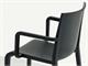 Stackable plastic chair with armrest Nassau in Living room